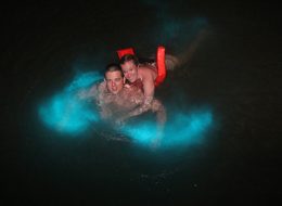 Couple swimming at Luminous Lagoon